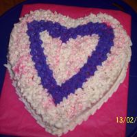 Heart Cake I made this with left over cake mix and icing from the cupcakes.....I have just started to decorated with the tips. Any suggestions would...