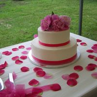 Ashley & Aaron Surprised her wedding guests with a flavor combination: Banana cake with Raspberry filling and iced with vanilla buttercream, Flowers were...