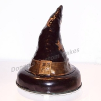 Which Witch Does This Belong To?? 8" round vanilla cake with RKT cone for the rest of the hat. Covered with MMF and airbrushed, attached fondant star, moon, painted...