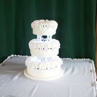 Christina This was a long process cake. It is dairy free, 3 different flavors,vanilla w/amaretto bc, lt. choc.w/pb bc, dk choc.w/rasp.fruit. the bc&#...