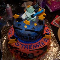 Yoda Star Wars buttercream w/ fondant accents. Yoda is candy clay