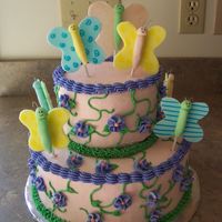 100_1408.jpg iced in buttercream with buttercream vines and flowers. fondant butterflies