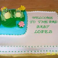 100_1145.jpg iced in buttercream. fondant frogs. made to match baby shower invitation. wish i had used more colors on it. too much white icing in my...