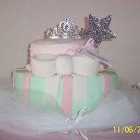 100_1329.jpg Princess themed cake. Iced in buttercream with fondant accents.