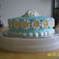 100_0943.jpg iced in buttercream. royal icing daisies