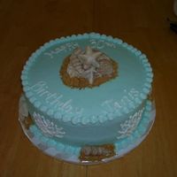 Seashellbirthday.jpg Seashell birthday cake. iced in buttercream with white chocolate seashells and graham cracker sand