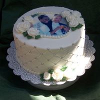 First Anniversary This is a gift for a friend at work, whose anniversary is this weekend. It's a white triple layer cake with whipped raspberry filling...