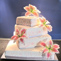 Simply & Elegant With Stargazer Lillies The first wedding cake I have made where I have never spoken to the bride or groom. I went to primary (grade) school with the brother and...