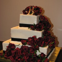 Black Ribbon/burgundy Roses My first square wedding cake. Fairly basic, white cake, black ribbon and the silk burgundy roses. She wanted an elegant look and I like the...