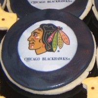 Chicago Blackhawk Hockey Pucks Sugar cookies with buttercream and MMF.