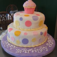 1St Birthday Cake Bottome layer is yellow cake with chocolate buttercream and top layer is a lemonade cake with lemonade buttercream. Cake is covered in MMF...