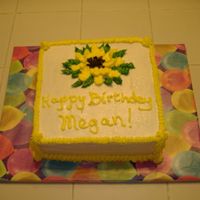 Sunflower Birthday Cake A lemon cake with buttercream icing. I tried making a sunflower but I think it needs work.