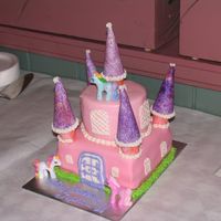 Niece's Little Pony Castle Made for my niece's 6th birthday. Castle is a 3 layer 8" devils' food cake square base w/ chocolate pudding and a 4 layer 6&...