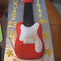 Electric Guitar Chocolate chip guitar cake. My first time working with MMF. I was really happy with how this turned out. I used embroidery thread for the...