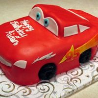 Just For Aiden My nephew is still in love with Cars so this was for his 3rd birthday. Sculpted out of smores cake and MMF details with donut tires!! He...