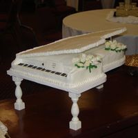 Baby Grand Piano Buttercream w/fondant roses & calla lilies. Cake was 2'x3' and fed 200.