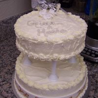 Gina's Brida Shower Cake Made this cake for my cousin's bridal shower tomorrow. It is a white cake with bavarian cream filling, buttercream frosting and royal...