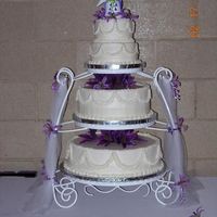 Pearls And Ruffles This was my first wedding cake - the bottom is a double layer 16" round, the center is a double layer 12" round (and we had one...