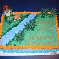 Happy Birthday Benjamin! For a special 3-year old boy. Diego, Baby Jaguar, and the trees were plastic, everything else is buttercream.