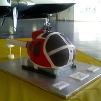 Helicopter foundant covered yellow cake with fruit filling