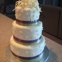 Brendas Cake 6,8,10 in cakes covered in fondant with satin ribbon