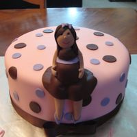 Preggo Chick hand molded figure on fondant covered cake