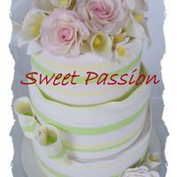 Multi Coloured Flowers &stripes Layered cake finished in fondant stripes and icing flowers. There were pink stipes but they faded overnight. Next time I'm using a...