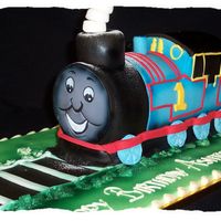 Thomas Train Cake This was a 3d thomas cake I did for a friends sons 2nd birthday. Wish I could put on the photo of his face, he loved it.