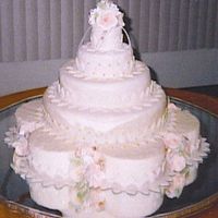 Johanna's Wedding Cake This is my 1st Wedding cake. I made it for a friend. The base had 7 dummy cakes on the bottom, a 14"x3", 10"x3", 6"...