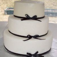 Bow Cake Bottom two are covered in fondant, the top is buttercream. Made for my mom's birthday ^^