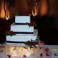 Black Ribbon And Roses THIS IS JUST A SIMPLE SQUARE CAKE WITH BLACK RIBBON AND A FEW RED ROSES.