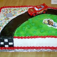 Lightning Mcqueen I made this cake today for my son's 7th birthday (tomorrow). 11 X 15 white cake with lemon filling. Airbrushed road and grass. Piped...