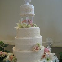First Wedding Cake 4 tiers, each with a different design. This was for my cousin...first wedding cake I have done & I am so happy with the results...each...