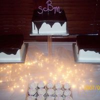 Square Cascading Cakes choc. drizzle on square shape cakes with fondant made monograms.