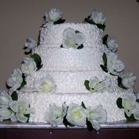 Desiree's Cake This is a cake that I made for my ex-daughter in law. It i iced with BC, cornellit lace design and silk roses