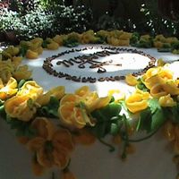 A Congratulatory Cake i decorated the buttercream iced banana cake in royal icing "golden showers" a kind of tropical flower similar to laburnum vossi...