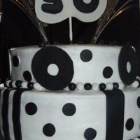 50Th Birthday Chocolate Cake with Raspberry Filling, Vanilla Buttercream Icing with Fondant accents. It was originally supposed to have fondant curlicues...
