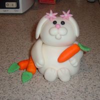 Bunny Luvs Carrots Fondant and GP sculpted bunny with smallest daisy cutout for hairpins, holding fondant carrots.