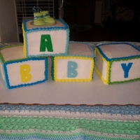 Baby Block Cake Baby block cake is made from 4- 6 inch square cakes and are triple layered for a block shape. The cake is all in buttercream icing.