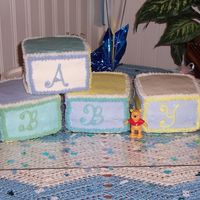 Baby Block Cake This was for my niece's baby shower. It is just 4-6" square cakes iced with multi colored buttercream icing. Simple decoration....