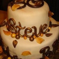 50 Th Birthday I made this cake for my wonderful father. The "50", leaves and words are all handmade from chocolate. The cake is covered in...