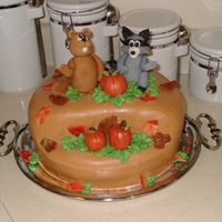 Fall Theme This is a birthday cake that I made for my father. He wanted a fall theme and jokingly asked for a racoon and a woodchuck waving "hi&...