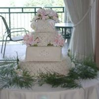 Mixed Wedding This is a 16 round, 10 square, 8 round and 4 square. And the ill placed cala lillies are there because I had a big rip in the fondant. uggh...