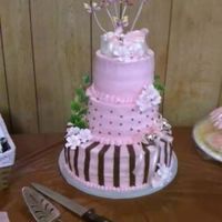 Pink And Brown Baby Shower Polka dots and strips botties and butterlies on top, silver rattle and cherry blossoms. Buttercream with fondant accents. Thanks for...
