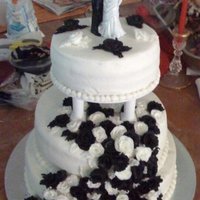 First Wedding Cake dark chocolate butter-cream roses with white butter cream icing. (wish i had a better picture)