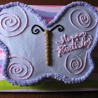 Tisha's Butterfly first carved cake i've ever done. it was difficult. i didn't use a sturdy cake and it wanted to crumble. i had to use MMF around...