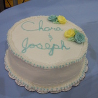 Turquiose And Yellow Side Wedding Cake buttercream except the royal icing roses.