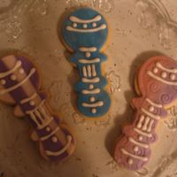 Rattles First time with fondant-I did rattles, onsies, fish, dress, and shoes. I'm still unsure which method I like best....