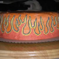 Flames this is another one of my first cakes. i freehanded the flames on to it with buttercream and then filled them in using the same.