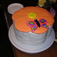 Flower Cake just a simple flower shaped cake topped with a mmf flower and butterfiy.